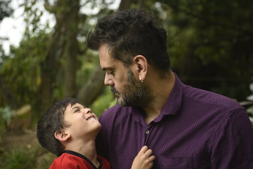 Free Man Holding Boy Stock Photo