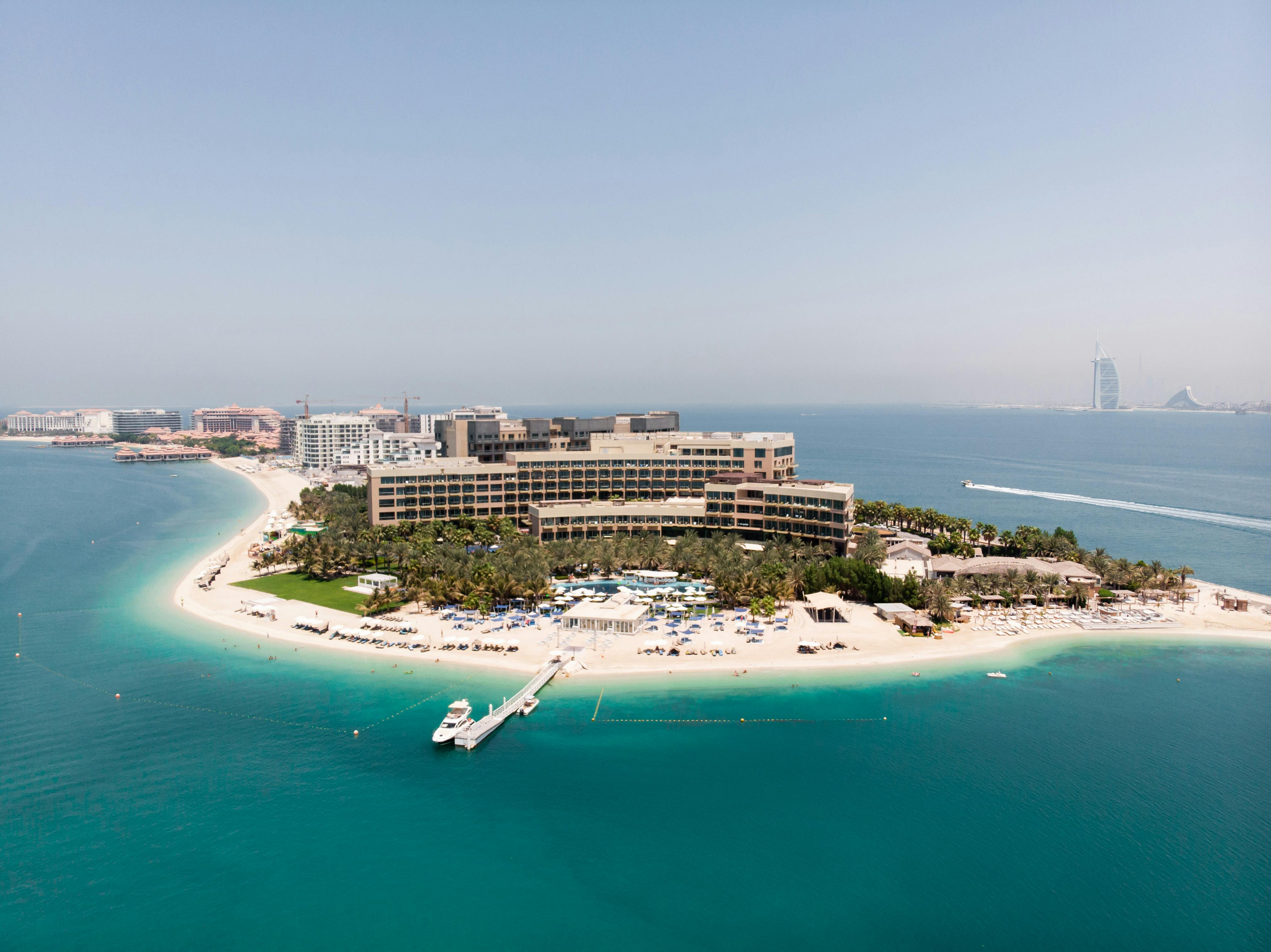 the island is surrounded by water and a resort