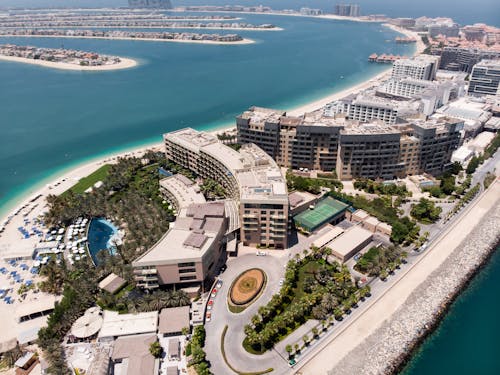 Free Brown Buildings near Body of Water in Aerial Photography Stock Photo