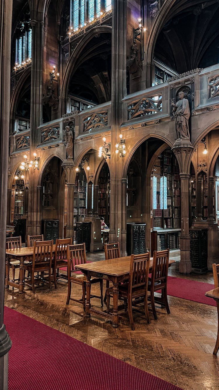 Wooden Tables And Chairs Inside The Building