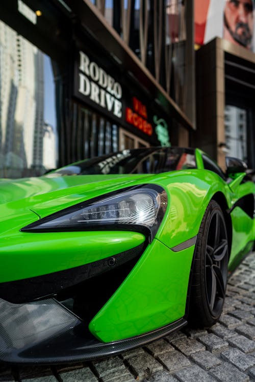 Free A Headlight of a Green Sports Car Stock Photo