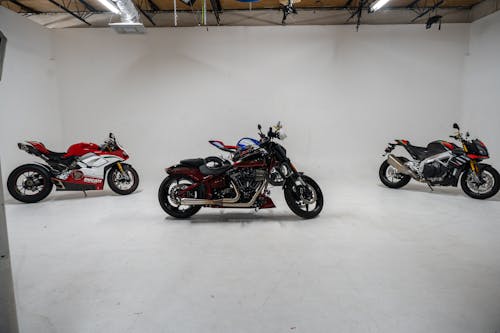 Three Motorcycles in a Studio 