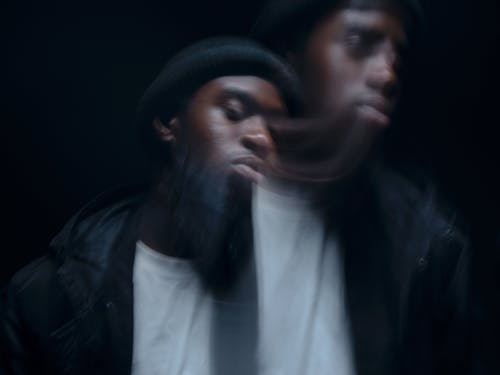 Young Man in Jacket and Hat