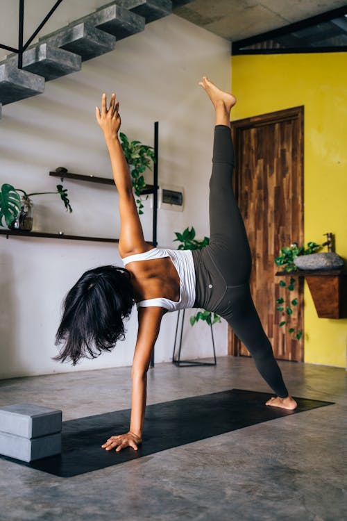 Brunette Woman Practising Yoga in Home