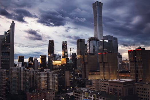 Stunning view of Beijing's modern skyscrapers under a dramatic twilight sky.