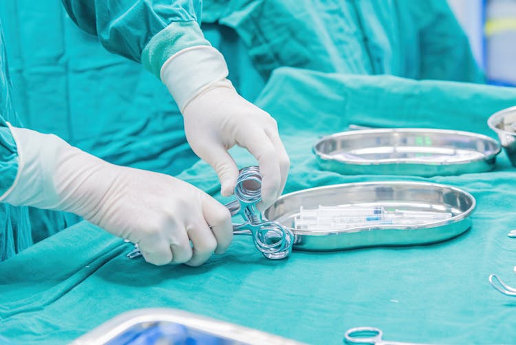 Hands Holding Scissors For Surgery