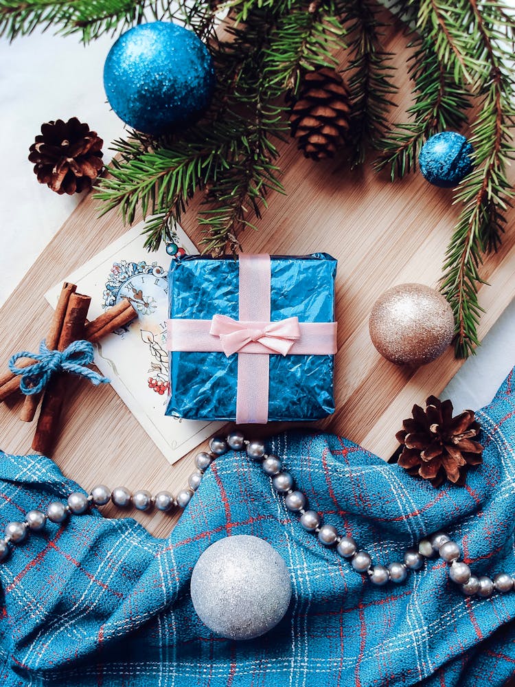 Wrapped Christmas Present On Wooden Table