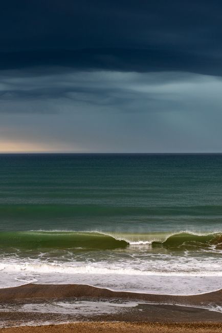 Captivating view of ocean waves under a stormy sky at Mar del Plata, Argentina.