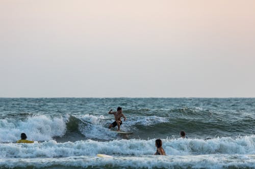 Man Surfing in the Waves of the Sea