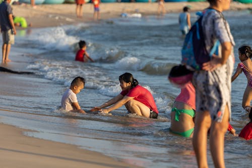 People Enjoying the Day on the Beach