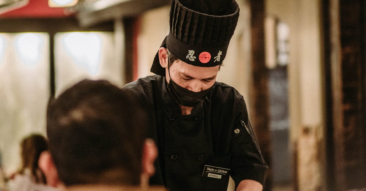 Man Wearing Black Toque and Face Mask Serving in a Restaurant · Free ...