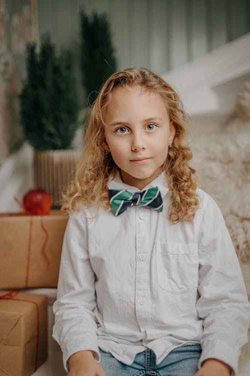 Portrait of Smiling Boy with Long Blond Hair