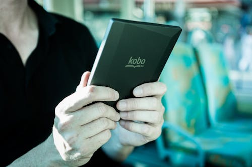 Free Person Holding Black Kobo Tablet  Stock Photo