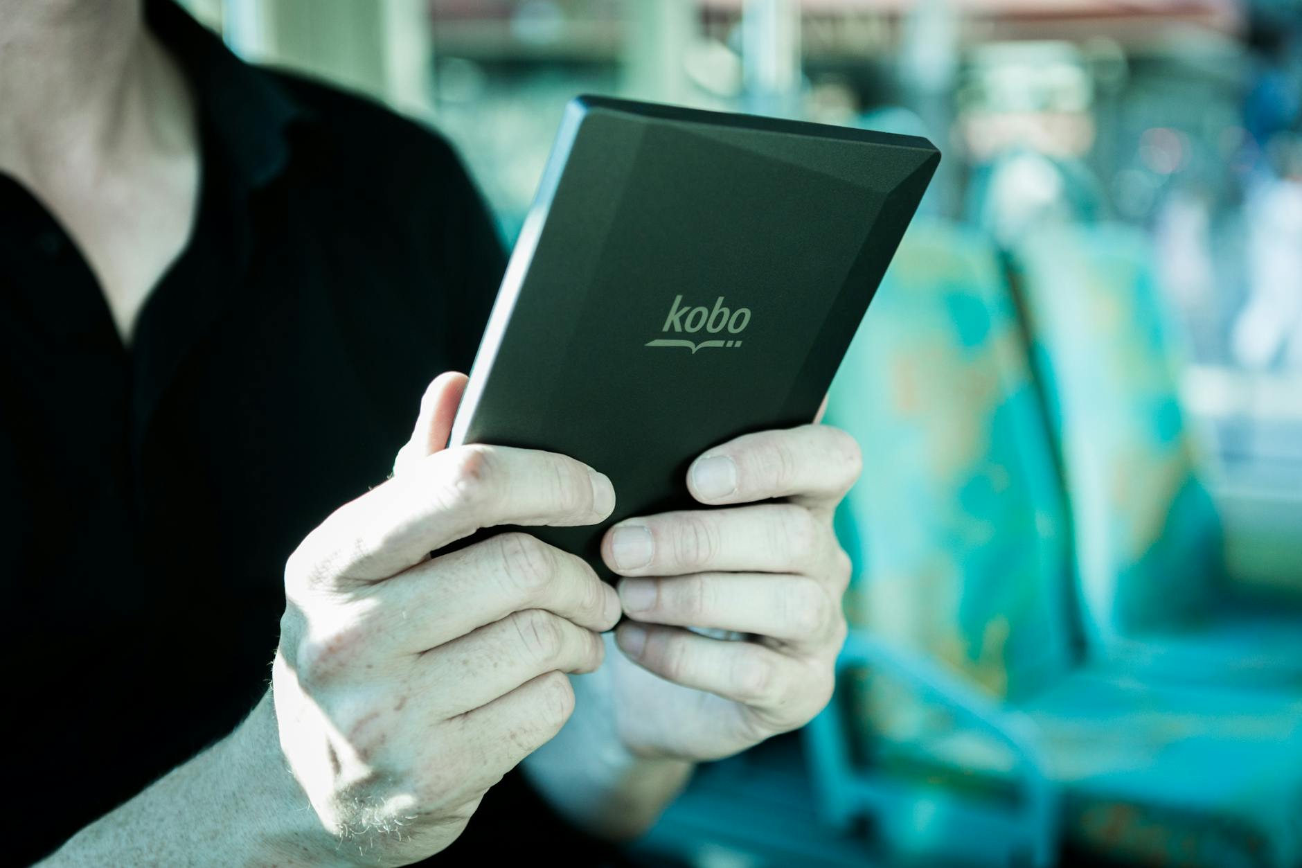 Person Holding Black Kobo Tablet