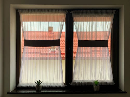  White Curtains on Glass Windows