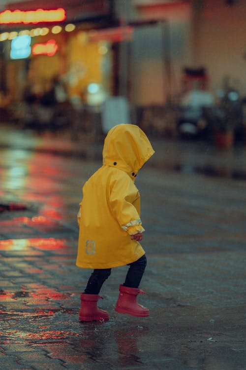 A Kid Wearing Yellow Raincoat