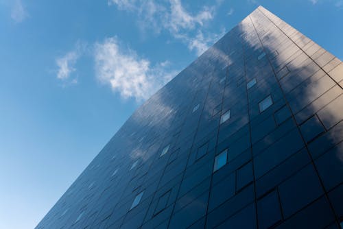 Low-Angle Shot of a High Rise Building under the Blue Sky