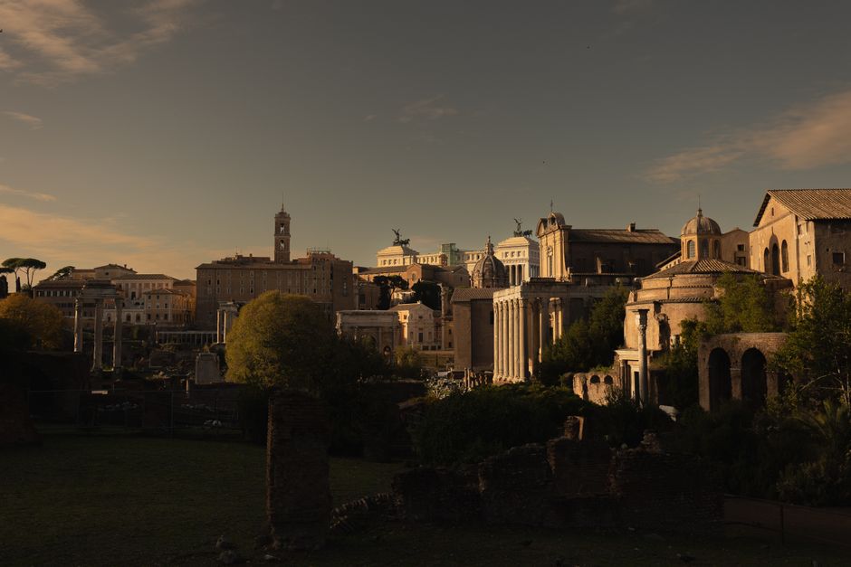 Captivating sunset view of historic Roman buildings, capturing ancient charm and architectural beauty.