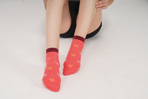 Close-up of Womens Feet in Red Socks 