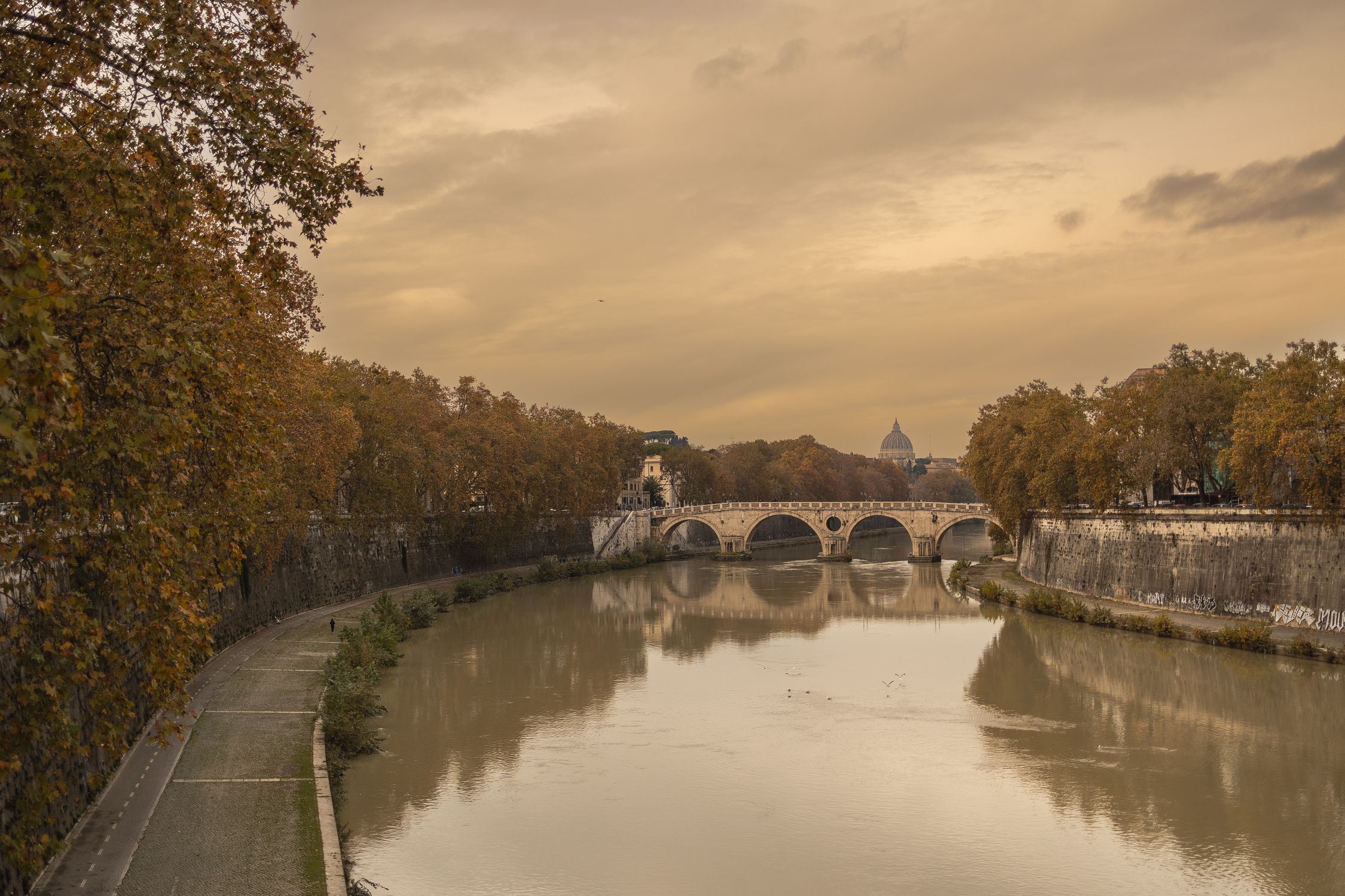 The river and historic bridge on the Tiber River in Rome