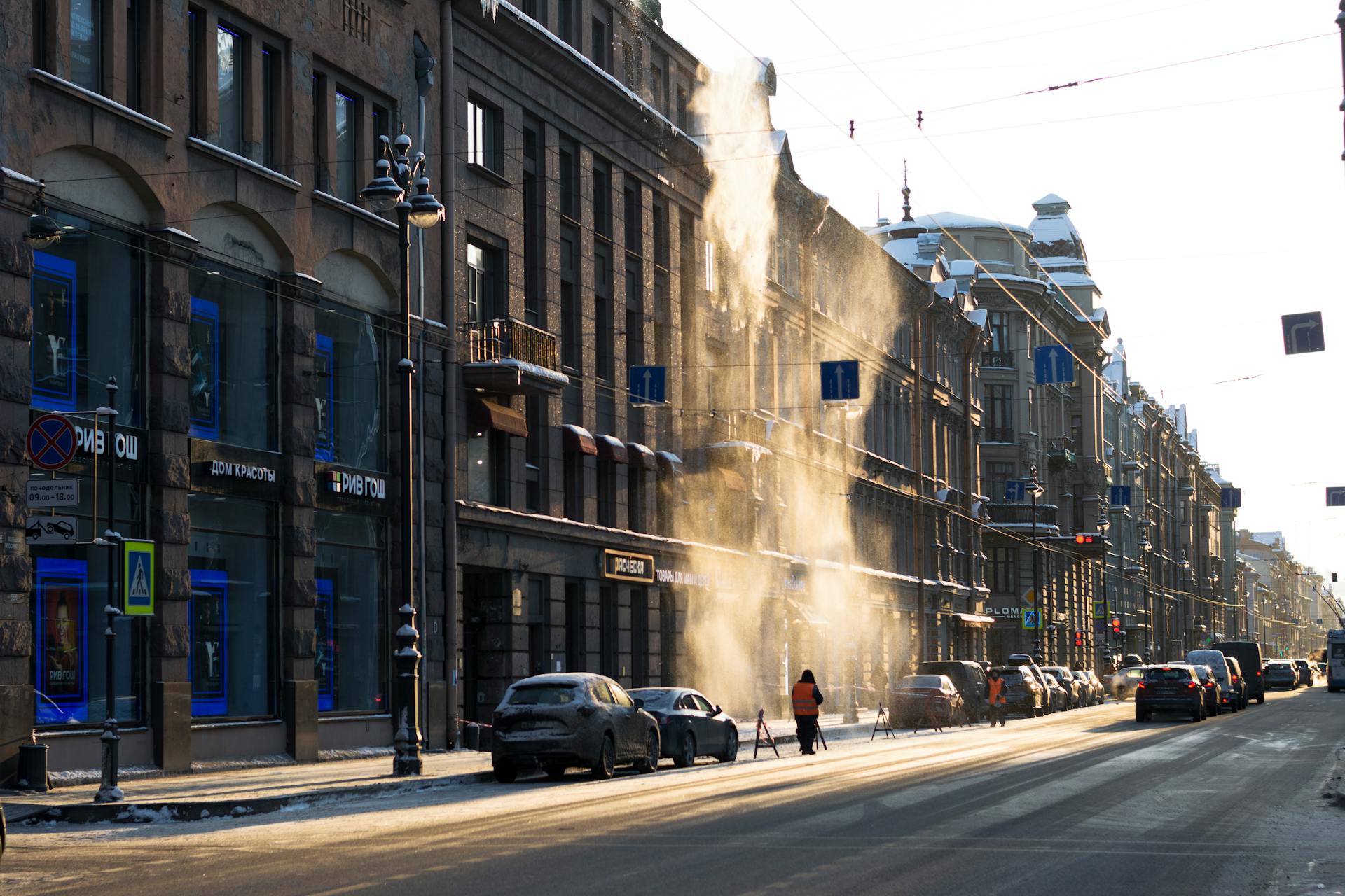 Sunlit street view of Nevsky Prospect in Saint Petersburg, capturing a winter morning glow.