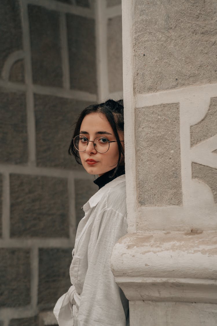 Photo Of A Woman Leaning On The Wall