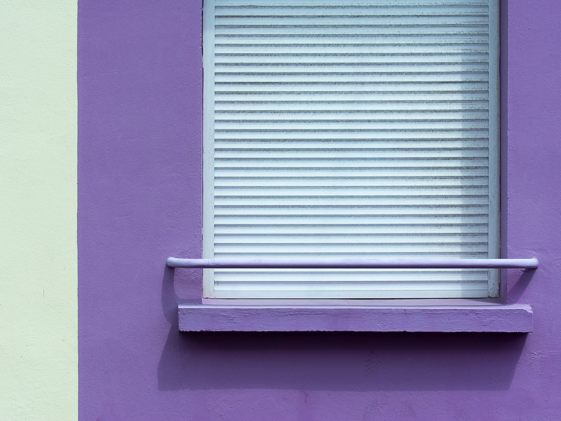 Exterior Painting in West Hampstead — a decorator at work mid-project