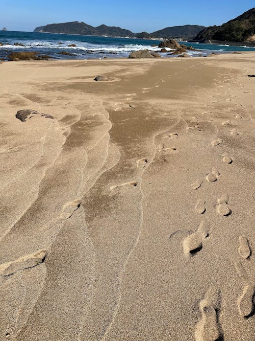 Close-up of Sand on the Beach with Sea in the Distance 