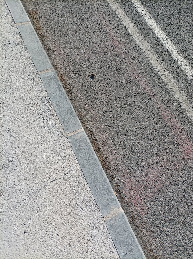 Curb Separating Sidewalk From The Street