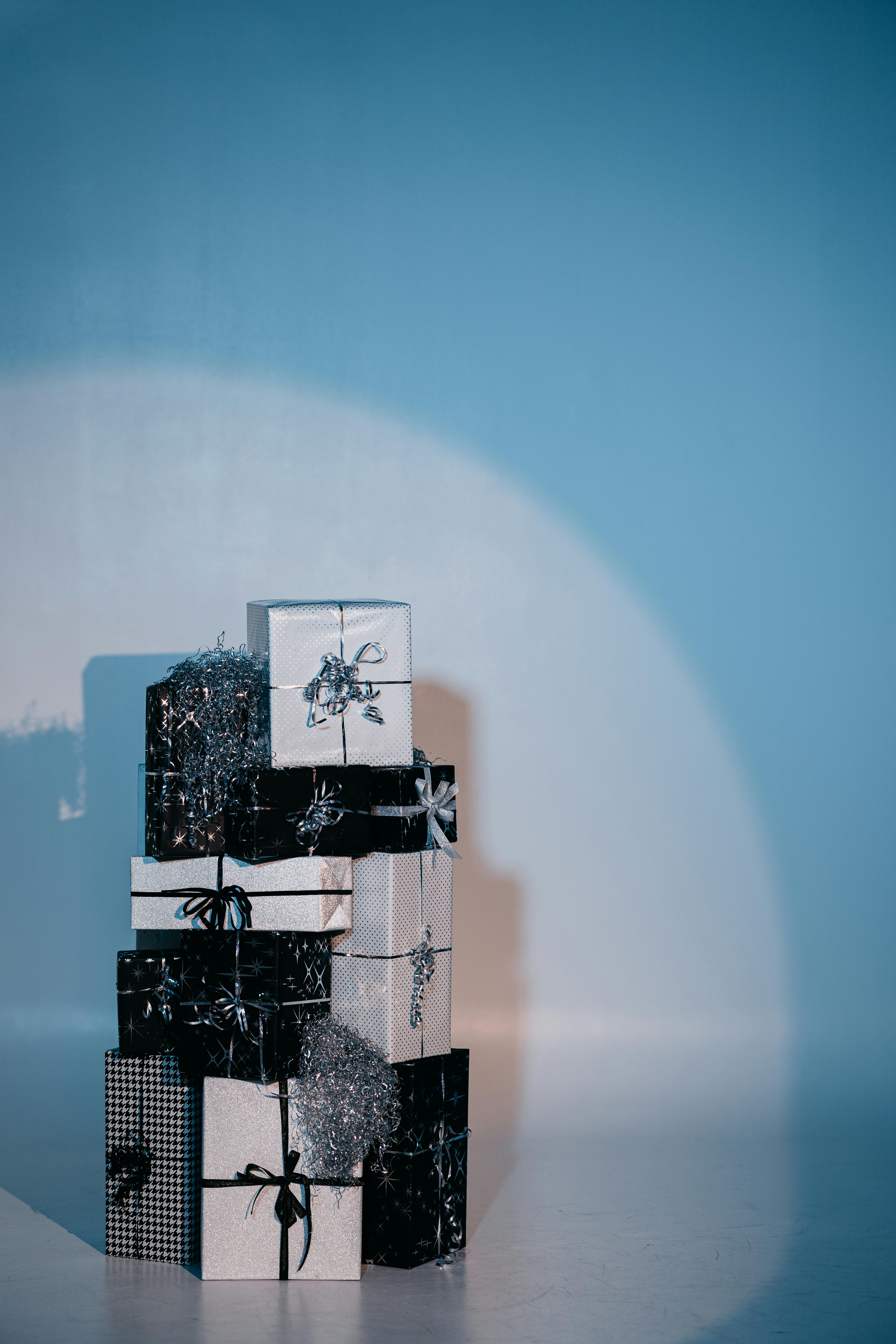 Black and White Gift Boxes on White Background · Free Stock Photo