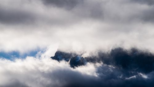 Free Dramatic clouds envelop the peaks of Torres del Paine in Chile, showcasing nature's power. Stock Photo