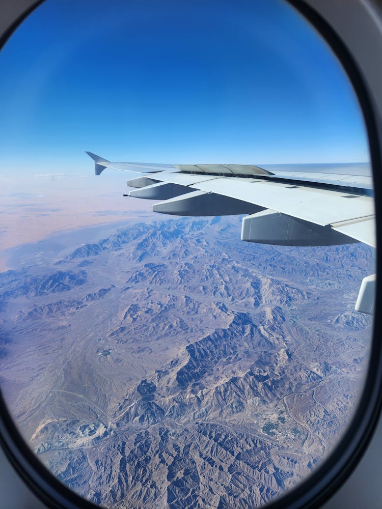 Hills Behind Airplane Window