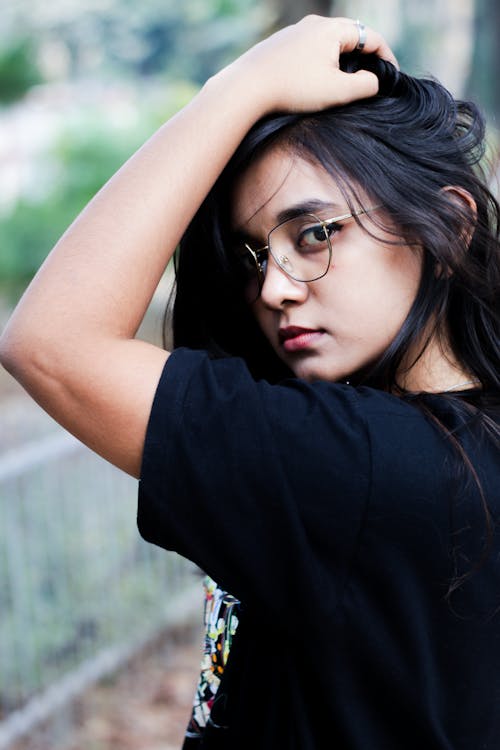 Woman in Black Shirt Wearing Eyeglasses