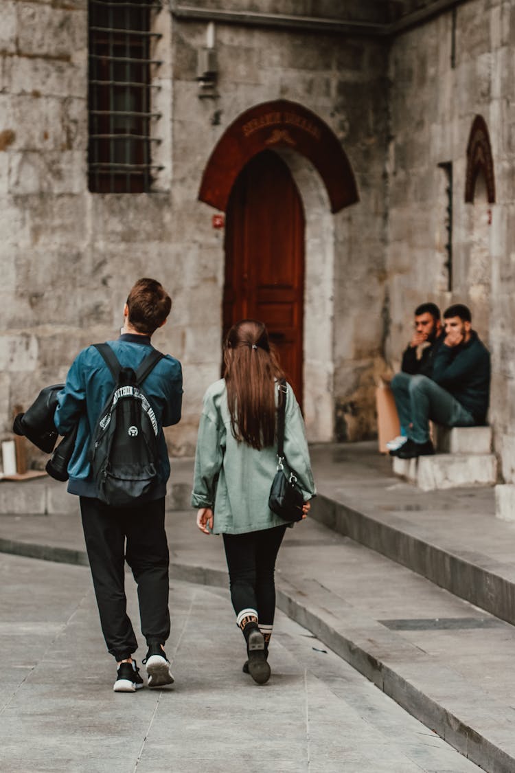 Man And Woman Walking On The Street