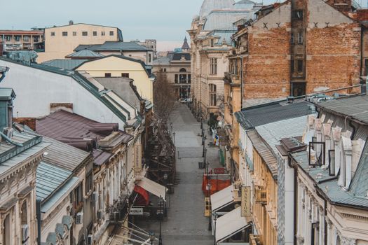 A picturesque view of a historic street in downtown Bucharest, Romania, showcasing classic European architecture.