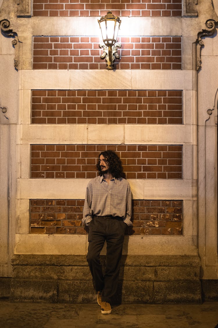 Man Leaning On A Wall