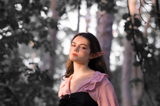 Girl with Elf Ears Posing in Forest