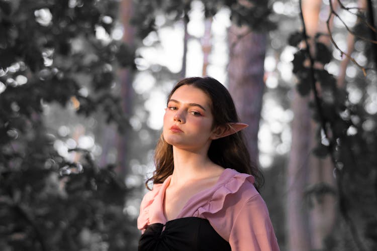 Girl With Elf Ears Posing In Forest