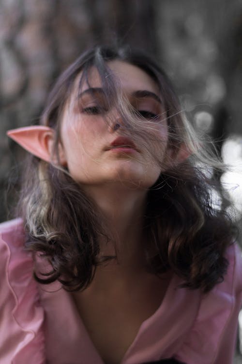 Young Woman with Elf Ears Posing in a Park