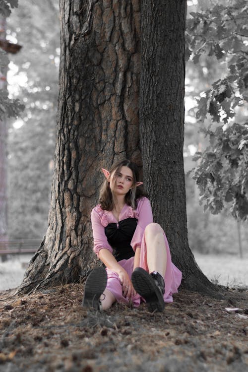 Young Woman with Elf Ears Posing in a Park