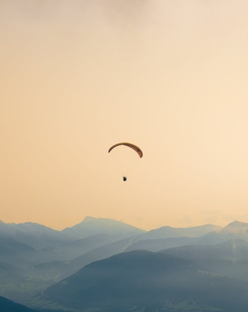 Free Paragliding in the mountains Stock Photo