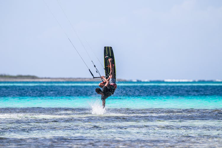 Man Doing Kitesurfing In The Ocean