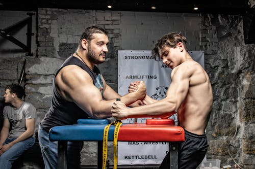 Photo of Two Men Arm Wrestling