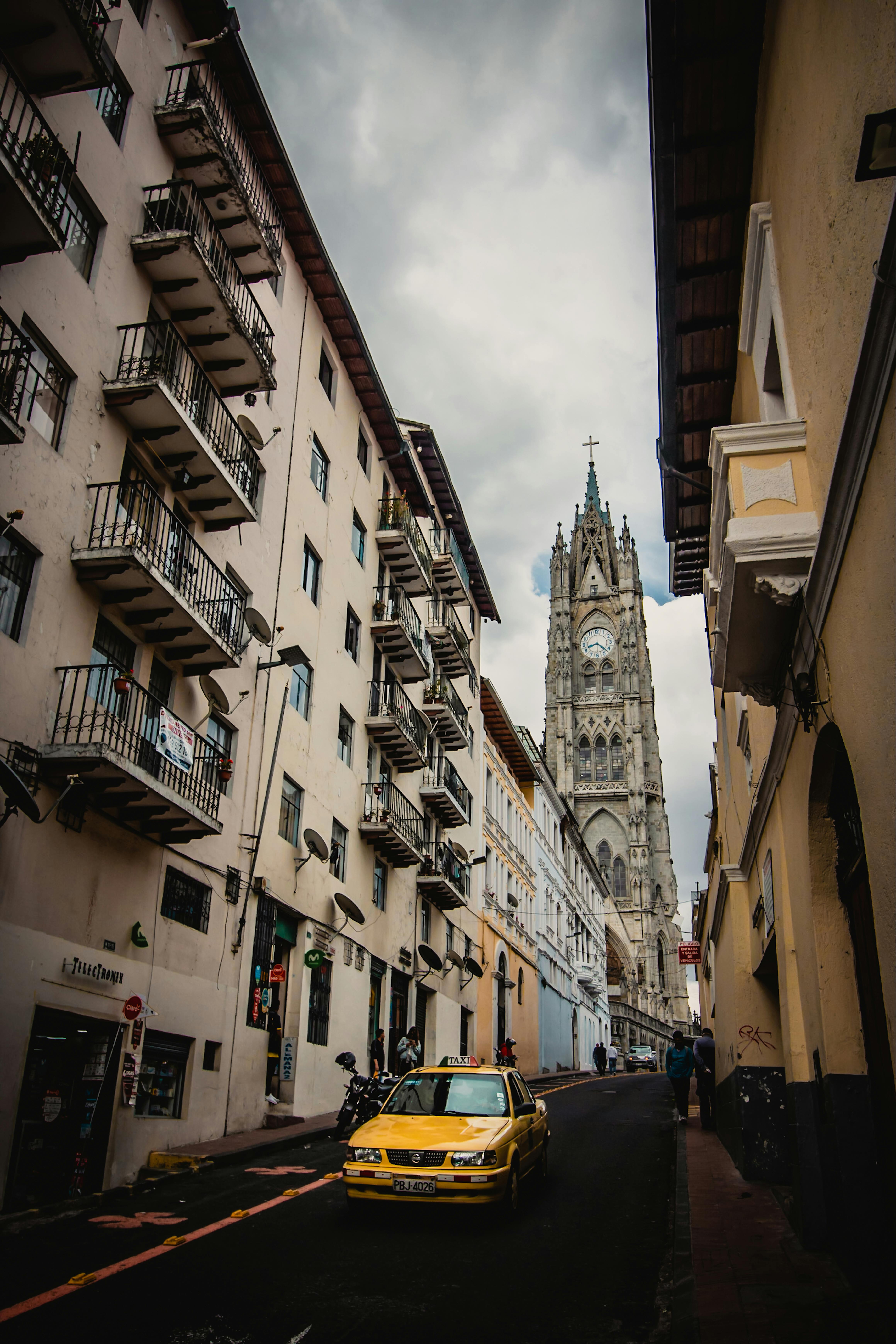 A Yellow Taxi on the Narrow Road · Free Stock Photo