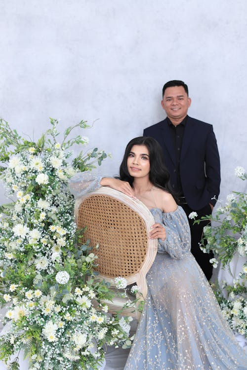 Two People posing with Flowers 