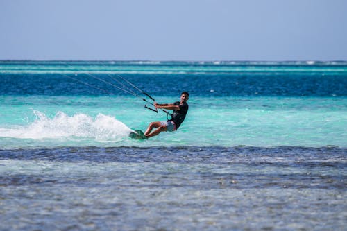 A Man Doing Kitesurfing