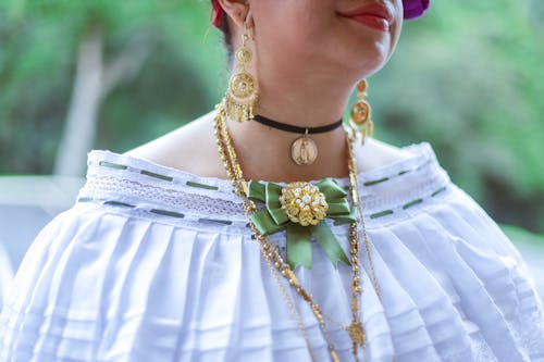 Woman Wearing Gold Jewelry