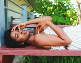 Photo Of Woman Laying On Wooden Bench