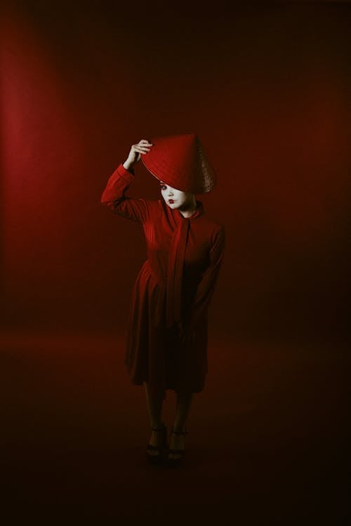 Woman Wearing a Red Outfit in a Red Room 