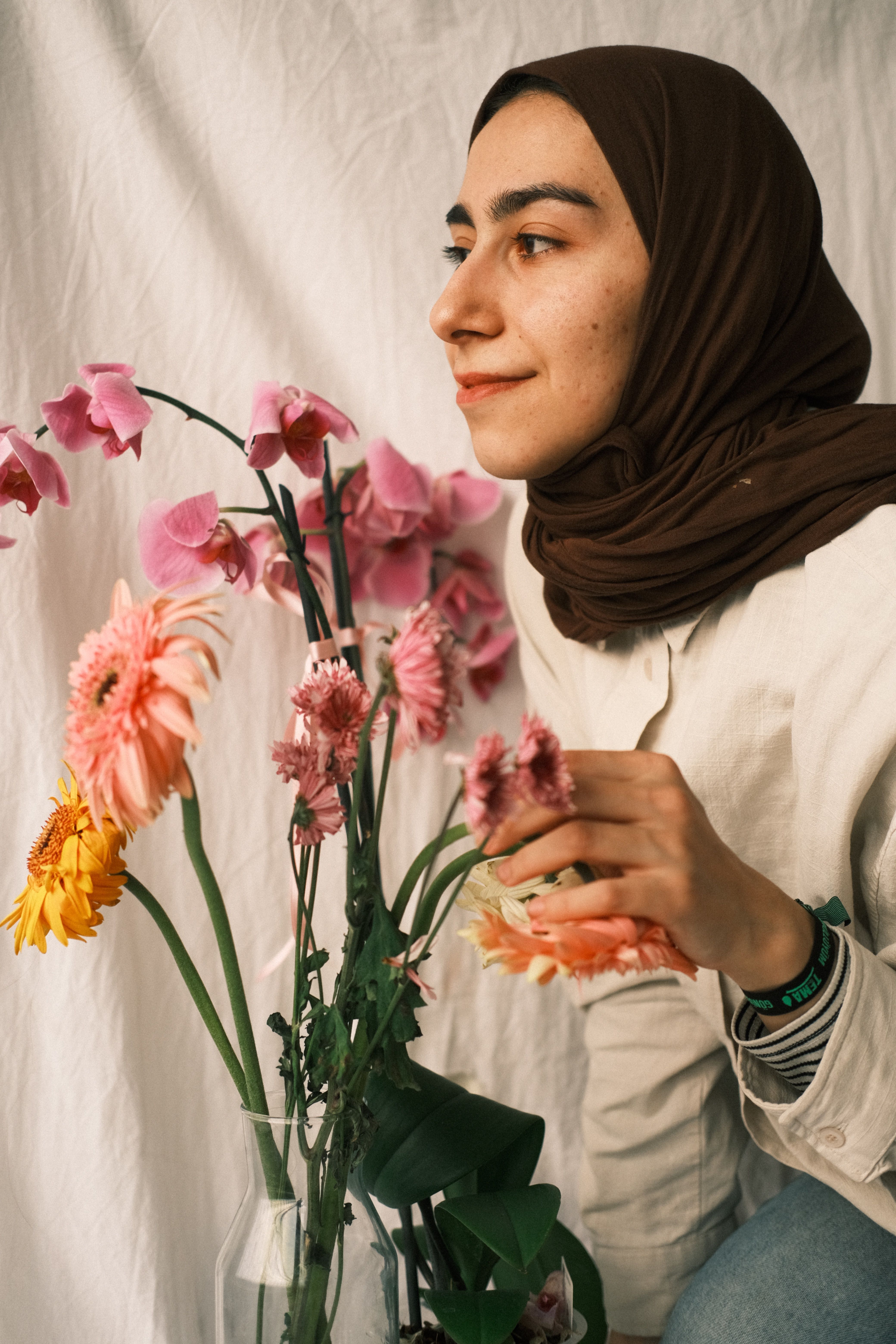 Smiling Woman with Flowers · Free Stock Photo